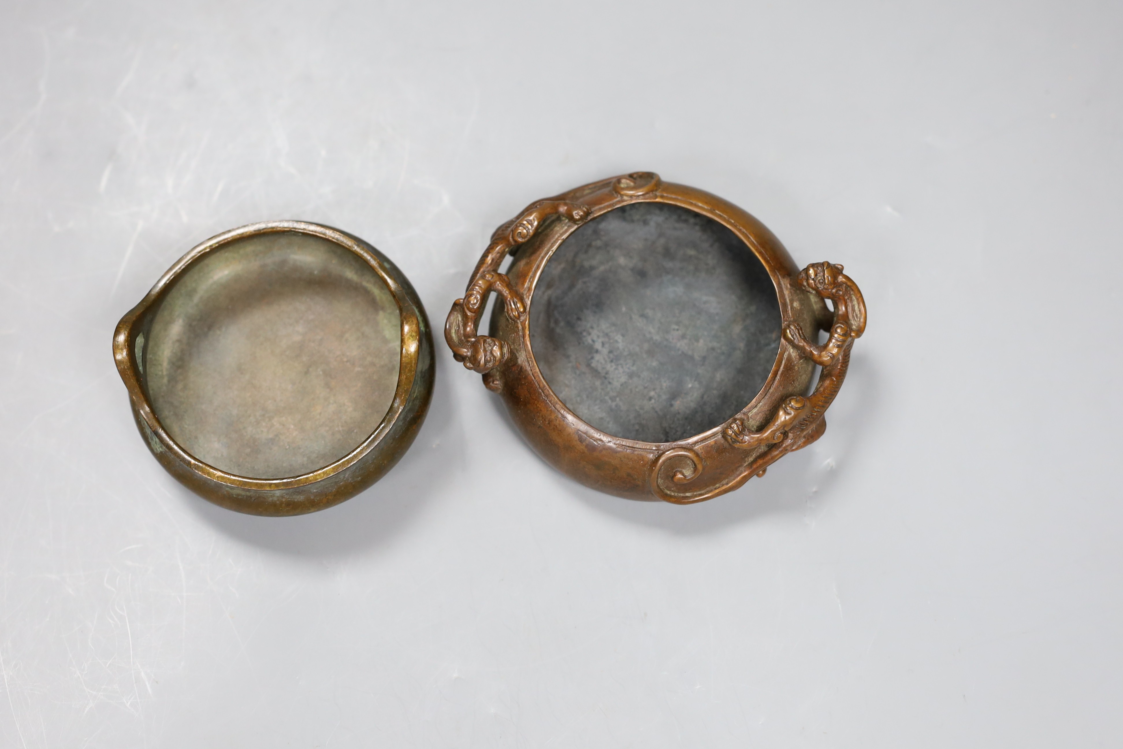 Two Chinese bronze censers, largest 11cms diameter